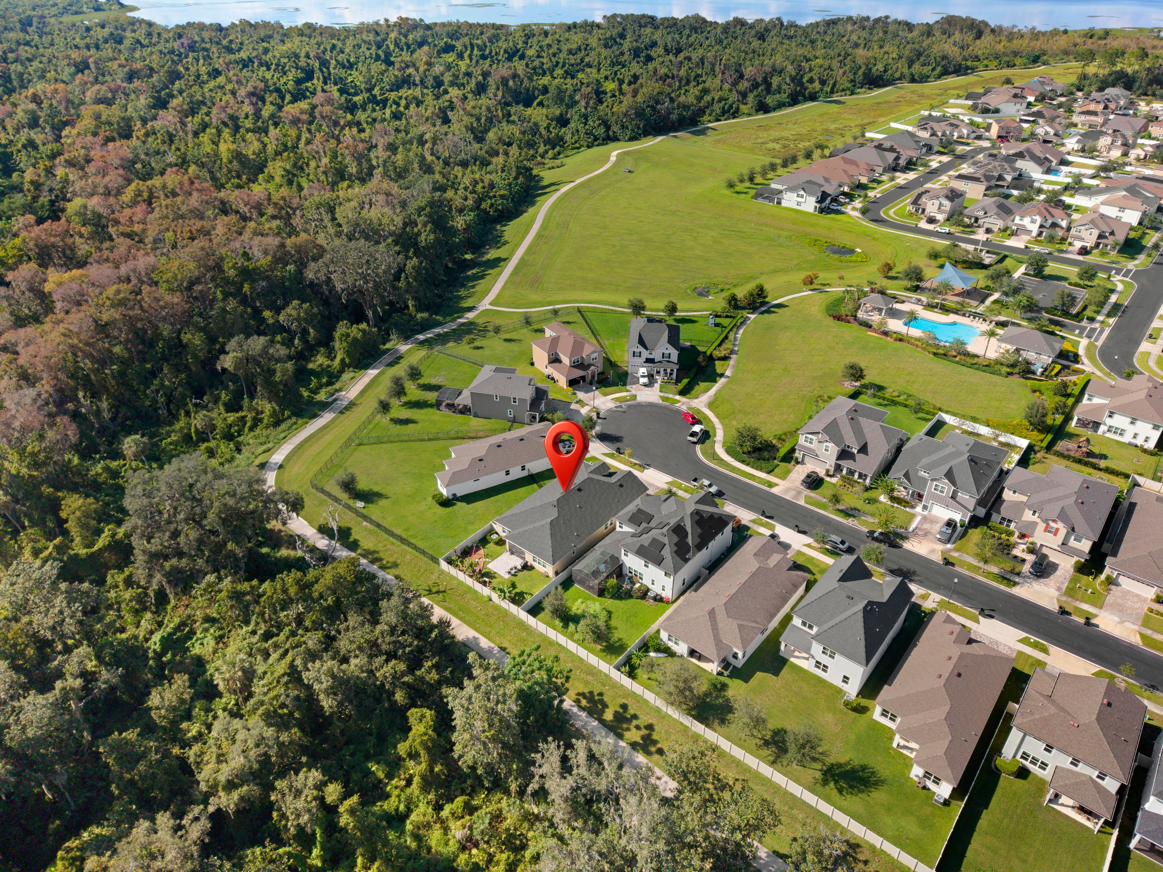 Aerial drone view of 2333 Farnham Dr and surrounding community, Ocoee FL